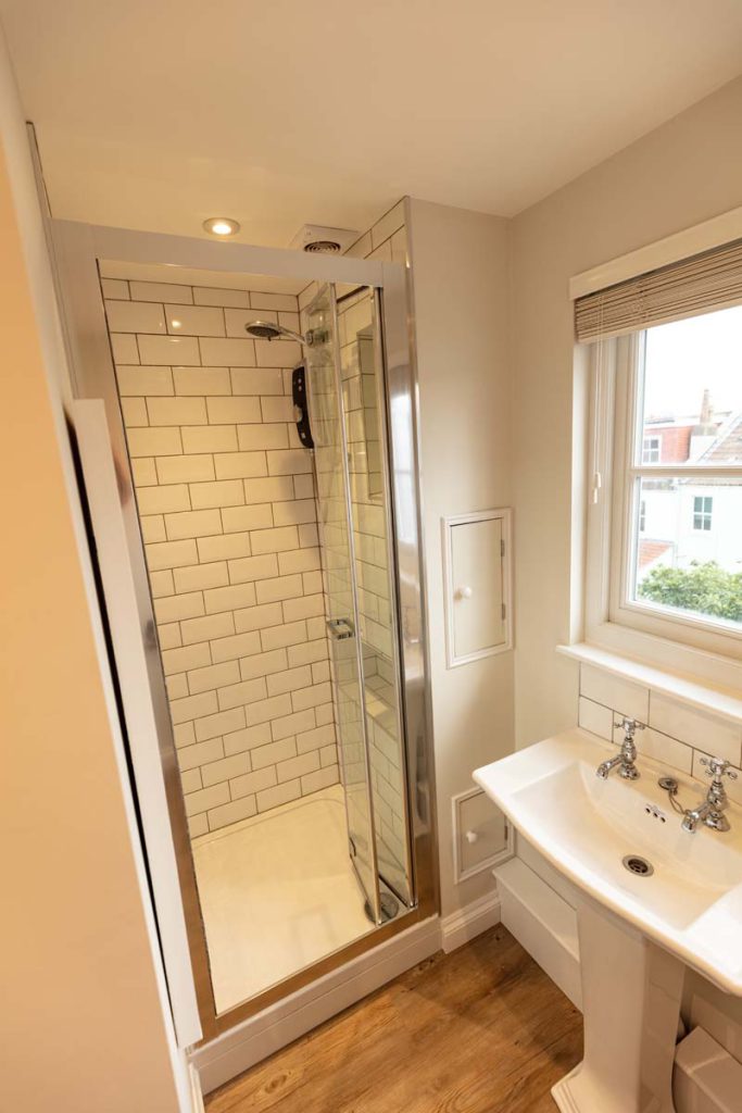 Metro-tiled shower enclosure in the shower room of a Bishopston dormer loft conversion