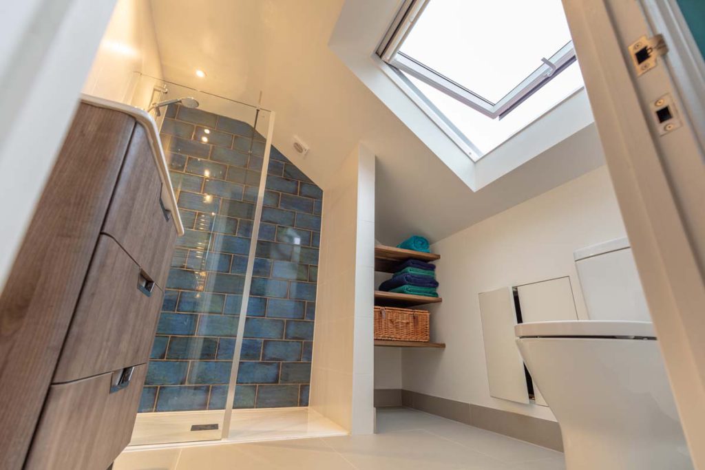 Walk-in shower and vanity beneath a rooflight in the en-suite of a Horfield dormer loft conversion