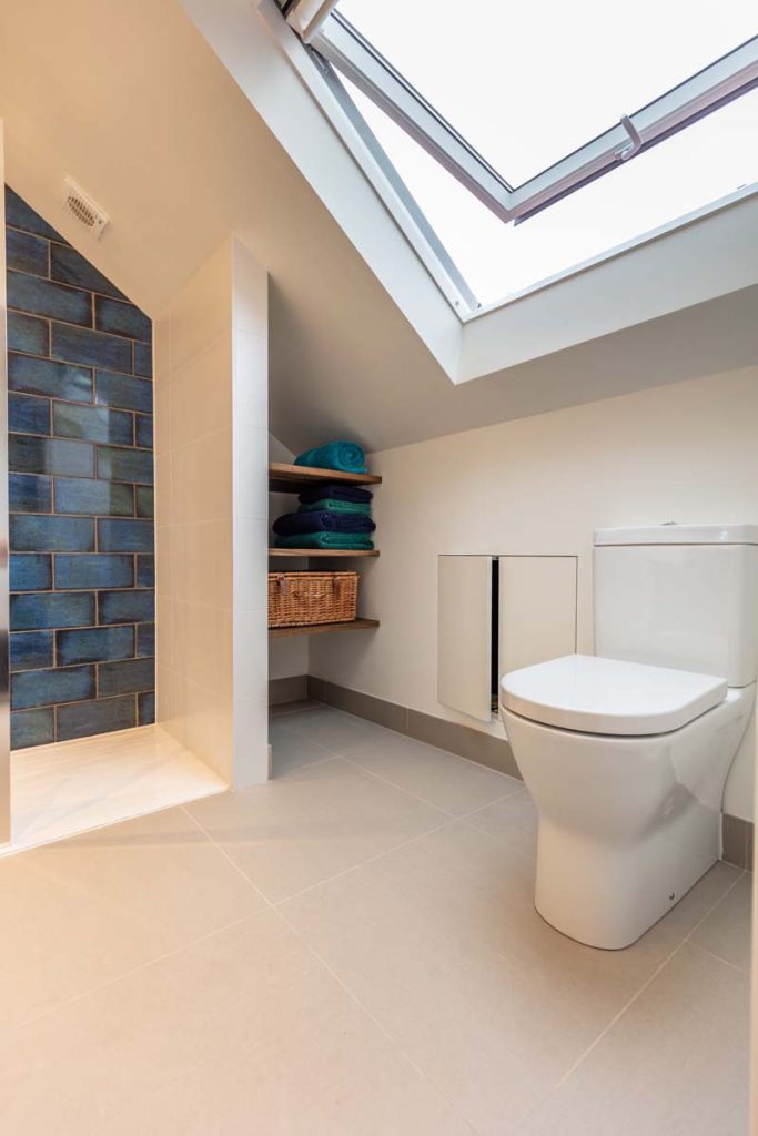 En-suite WC with eaves towel shelving and a rooflight in a Horfield dormer loft conversion