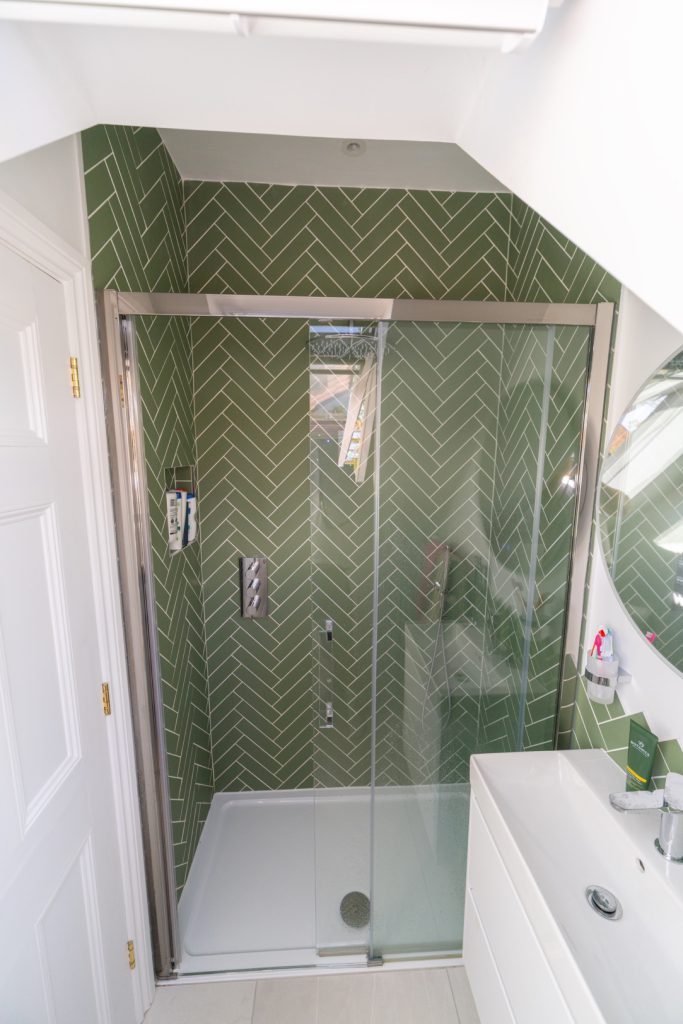 En-suite with a green herringbone-tiled walk-in shower in a Redland dormer loft conversion, Bristol