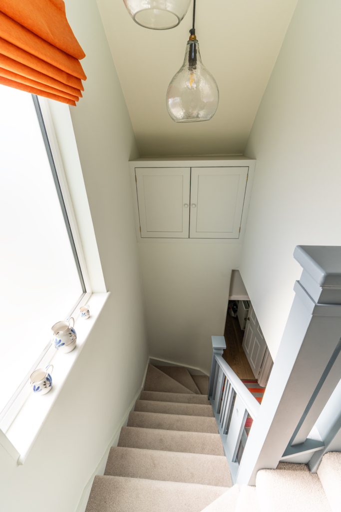 Bespoke cupboards built into the stair space of a Redland dormer loft conversion, Bristol