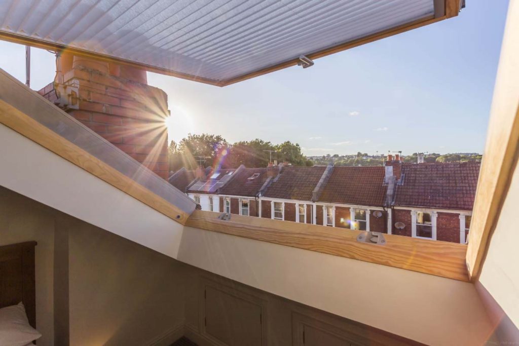 View over Victorian rooftops from the large skylight of a dormer loft conversion in St Werburgh's, Bristol