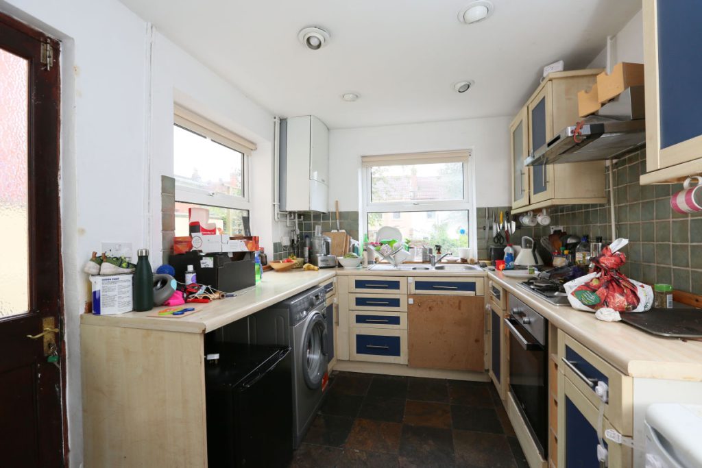Original galley kitchen before refurbishment in an Easton house, Bristol