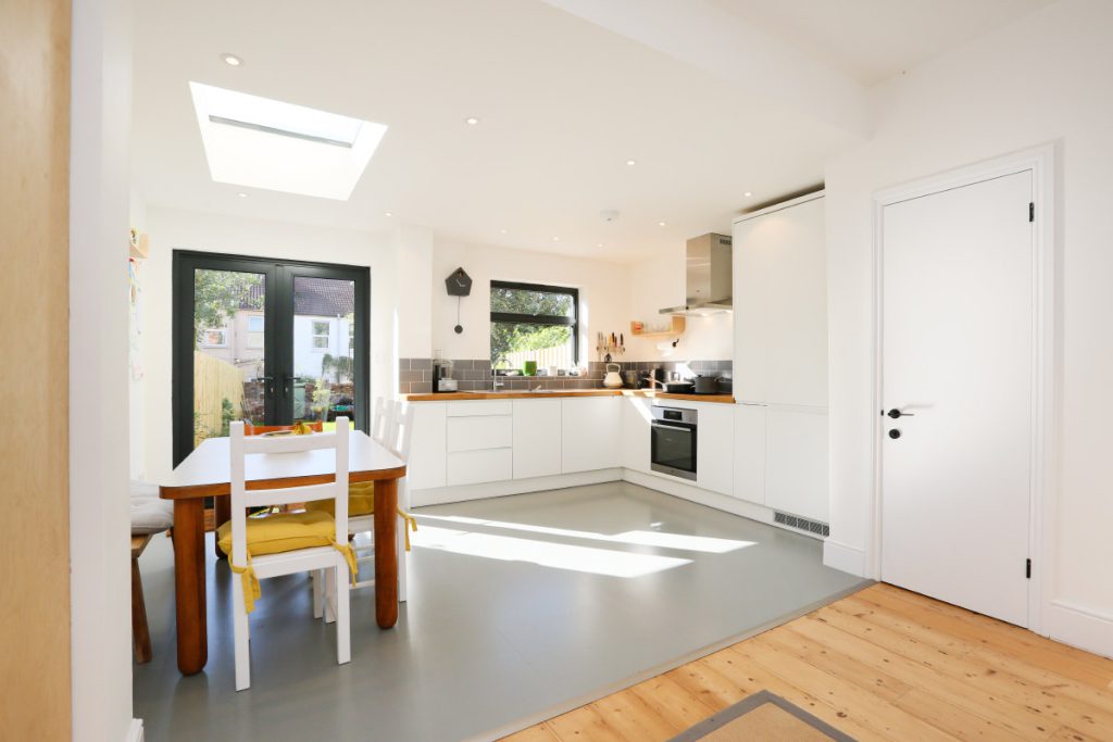 New white kitchen with wooden worktops and a rooflight in a full house refurbishment in Easton, Bristol