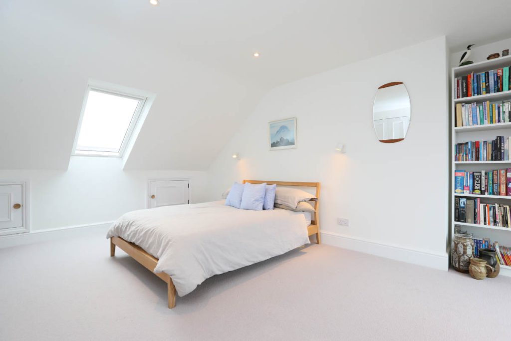 Loft bedroom with a rooflight and built-in eaves storage in an Easton loft conversion, Bristol