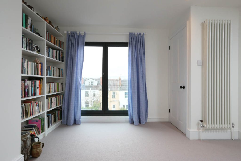 Loft room with French doors and a Juliet balcony in a full house refurbishment and loft conversion in Easton, Bristol