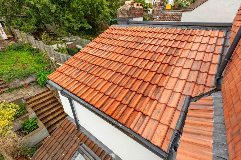 New clay pantile roof and full-width dormer above the rear garden of a Bedminster terrace loft conversion