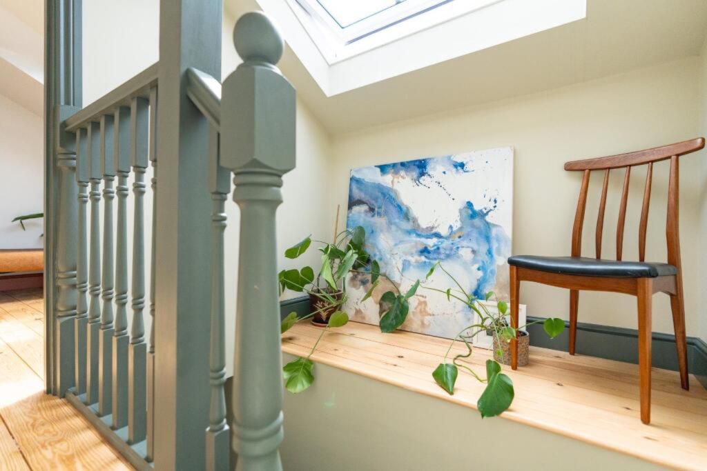 Landing and unique painted staircase beneath a skylight in a full-width dormer conversion in Montpellier, Bristol