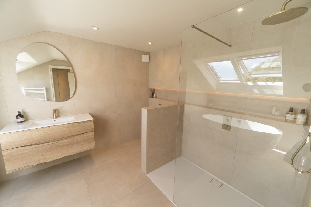 Large en-suite with a walk-in shower and freestanding bath in a hip-to-gable loft conversion in Bishopston, Bristol