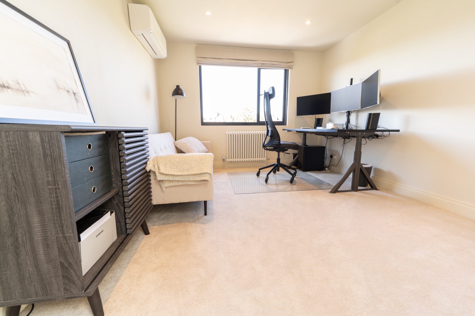Home office with a dual-monitor desk in a hip-to-gable loft conversion in Bishopston, Bristol