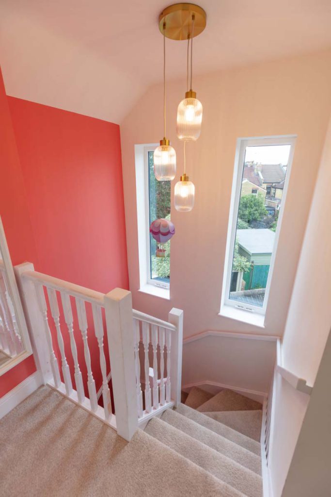 Top of the new staircase and loft landing with cluster pendant lights in a Brislington hip-to-gable conversion