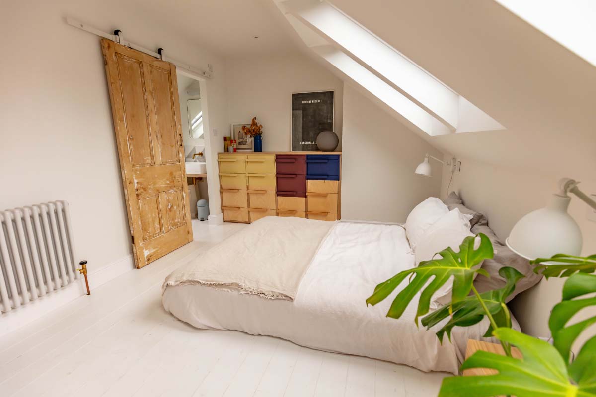 Bespoke plywood chest of drawers and a refurbished Victorian door in a Montpellier skylight loft conversion