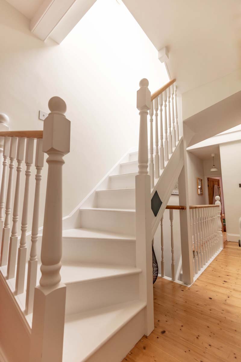 Bespoke timber staircase in a Bristol loft conversion by J Vincent