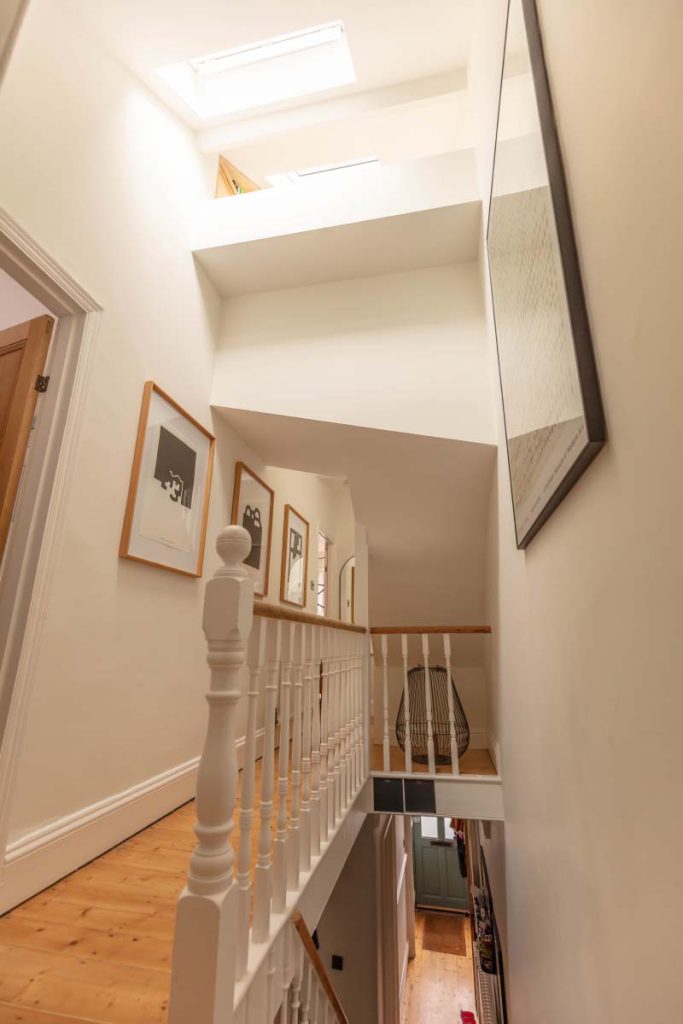 Stairwell flooded with daylight from a skylight above the landing in a Montpellier loft conversion